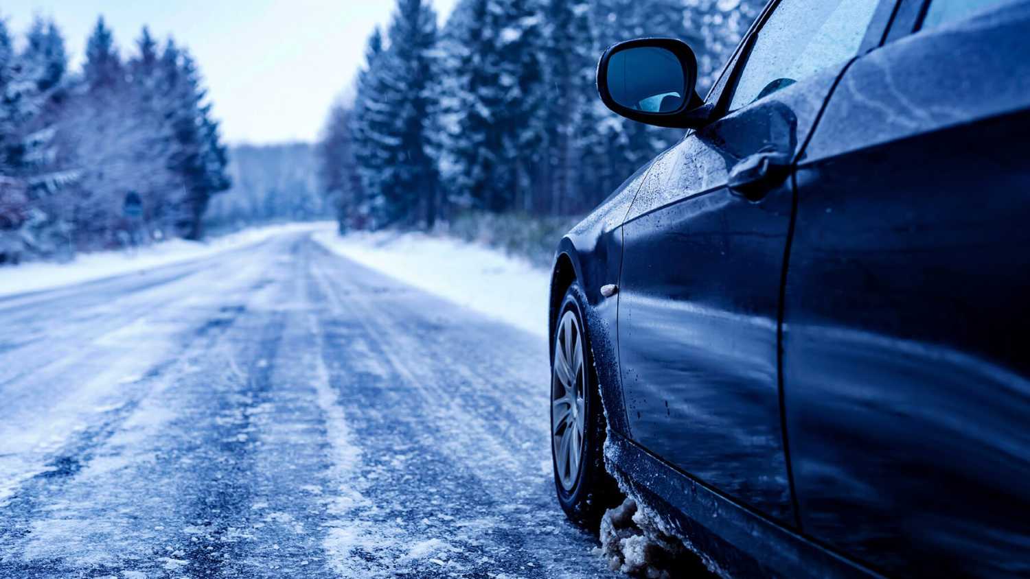 Winter chauffeur service with luxury vehicle and professional driver providing safe seasonal transportation